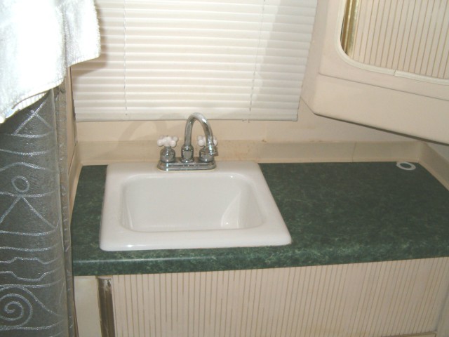 Replcaed old plastic sink with counter top and new sink.