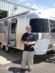 Our tour guide beside a "fresh" from the factory floor Airstream!